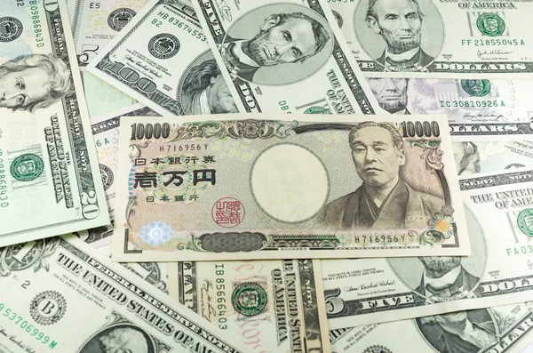 depositphotos_34255611-stock-photo-japanese-yen-notes-on-many.jpg
