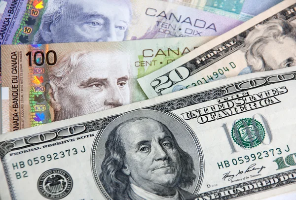 depositphotos_16811249-stock-photo-canadian-dollars-vs-us-dollars.jpg
