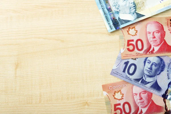 depositphotos_73835041-stock-photo-canadian-dollars-on-wooden-table.jpg depositphotos_73835041-stock-photo-canadian-dollars-on-wooden-table.jpg