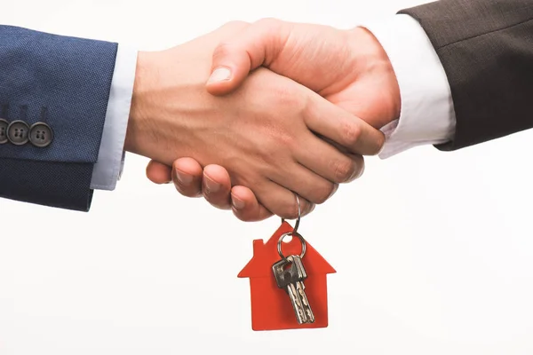 depositphotos_176137666-stock-photo-cropped-image-shaking-hands-key.jpg