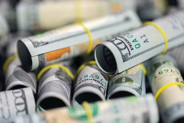 depositphotos_753608992-stock-photo-close-twisted-100-dollar-bills.jpg