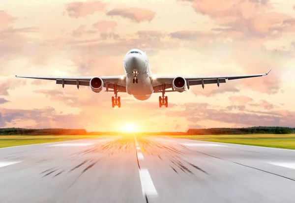 depositphotos_174264334-stock-photo-passenger-airplane-landing-at-sunset.jpg