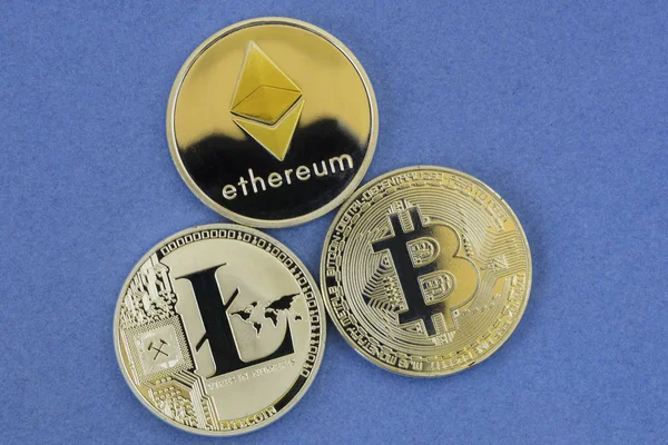 depositphotos_184808402-stock-photo-litecoin-bitcoin-ethereum-lie-blue.jpg
