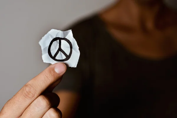 depositphotos_123612968-stock-photo-man-with-a-peace-symbol.jpg