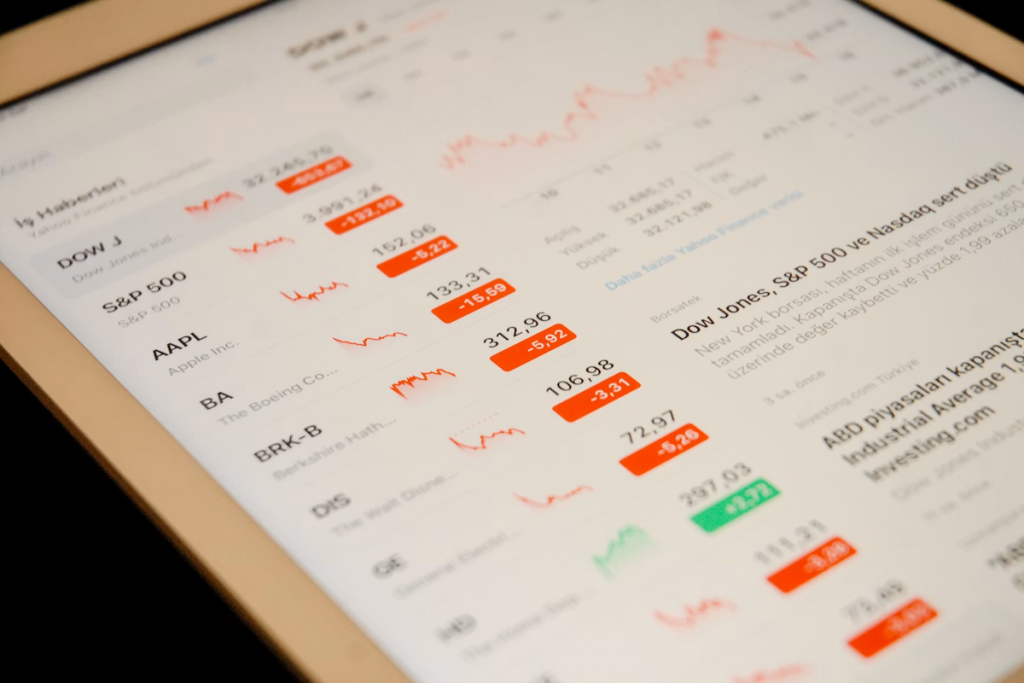 Image of tablet showing the stocks fluctuate; Data Shift