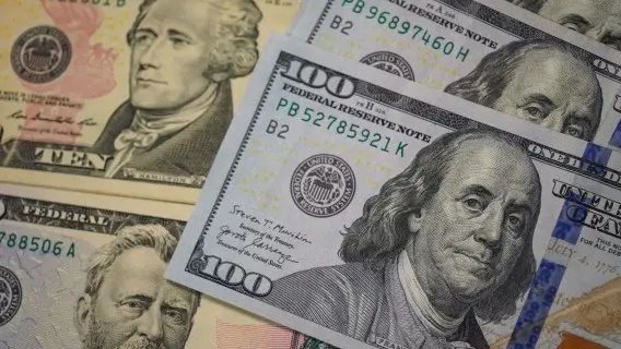 The dollar is holding onto gains following Kevin Warsh's dovish speech last week