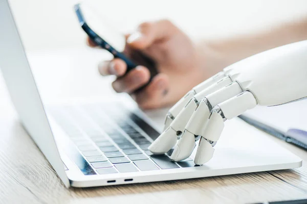 depositphotos_195402338-stock-photo-close-view-human-robot-hands.jpg