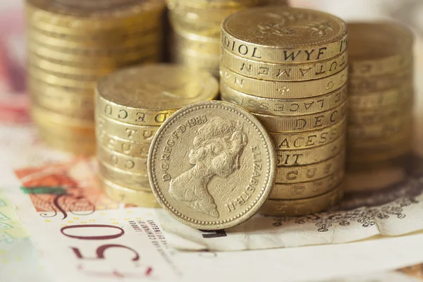 depositphotos_97881380-stock-photo-bunch-of-british-pound-coins.jpg