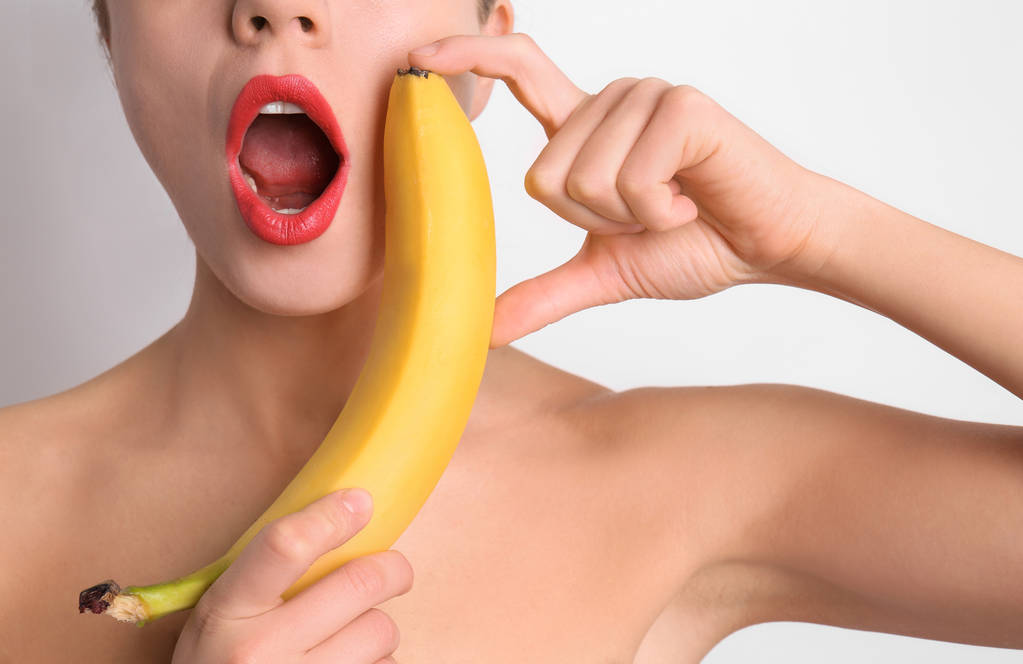 stock-photo-sexy-young-woman-banana-light-background-erotic-concept.jfif