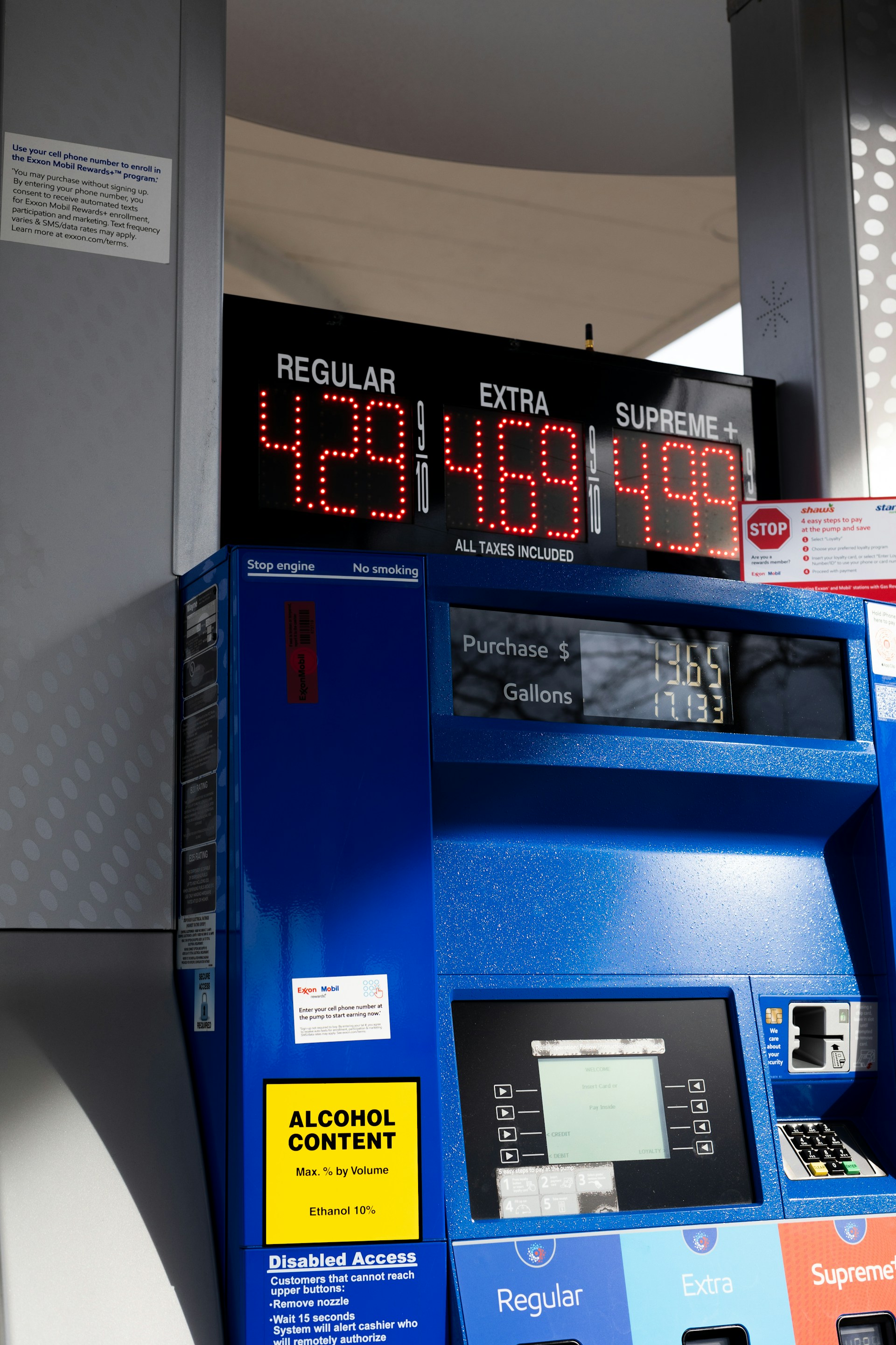 Photo of gas pumps showing prices per gallon of $4.29 and higher.