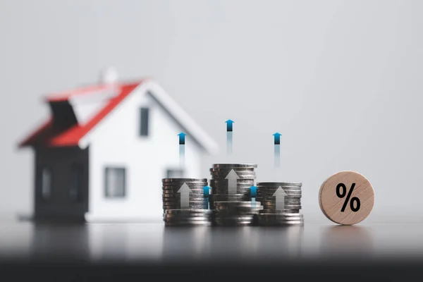 depositphotos_655364728-stock-photo-stacks-coins-model-house-percentage.jpg