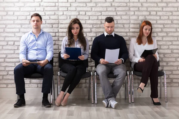 depositphotos_161318870-stock-photo-group-people-sitting-chair-waiting.jpg