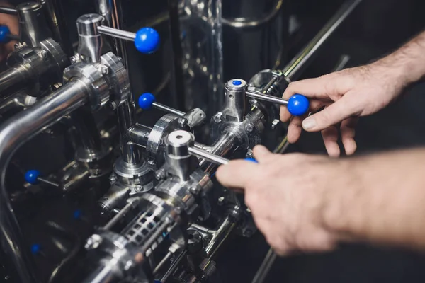depositphotos_133344242-stock-photo-brewer-working-with-industrial-equipment.jpg
