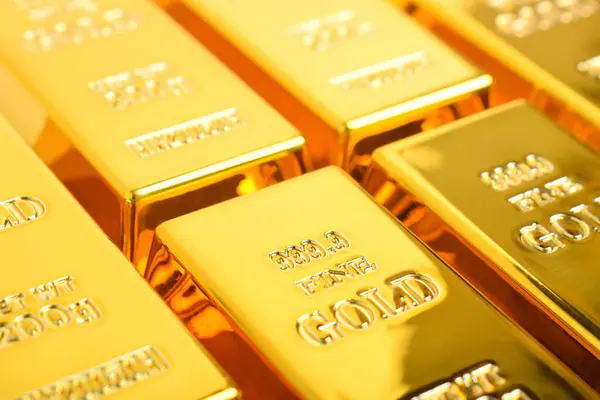 depositphotos_765588760-stock-photo-close-many-shiny-gold-bars.jpg