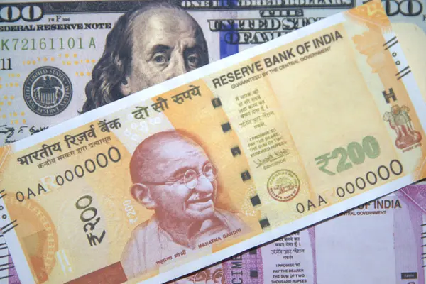 depositphotos_779123930-stock-photo-100-dollar-bill-indian-rupees.jpg