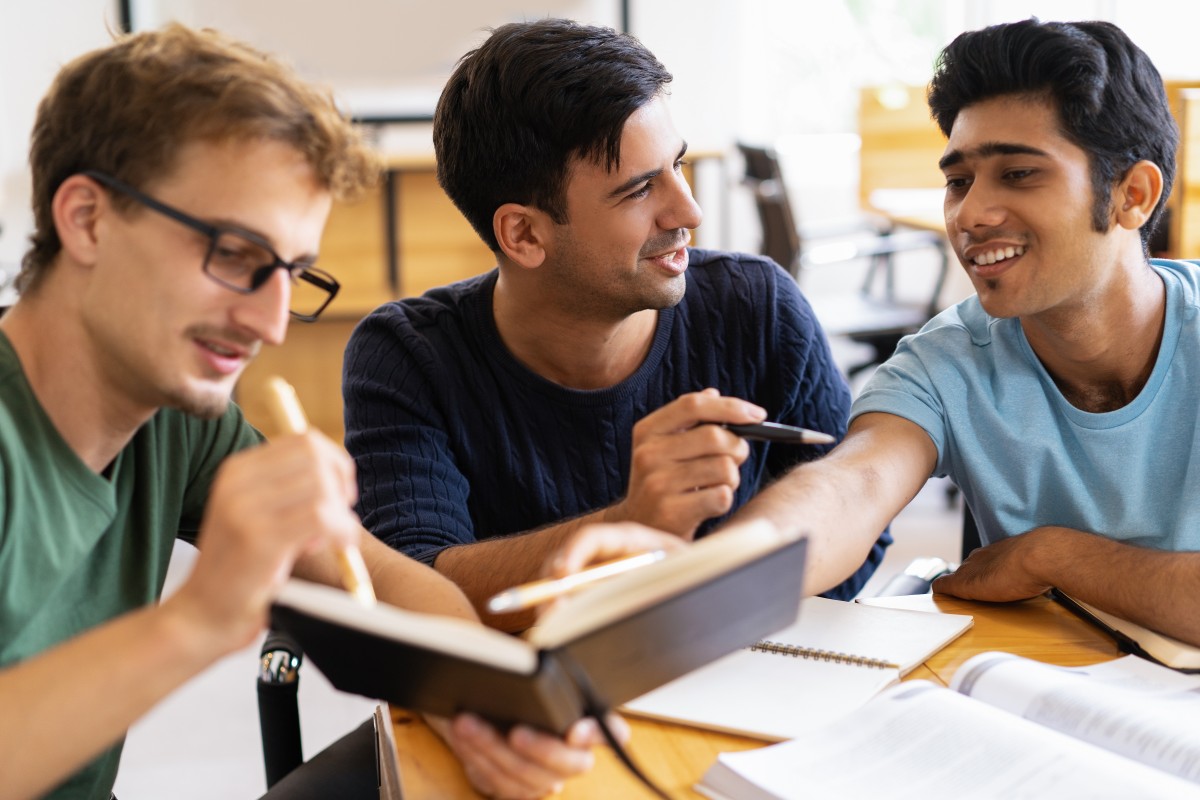 three-smiling-students-studying-doing-homework-together (1).jpg three-smiling-students-studying-doing-homework-together (1).jpg