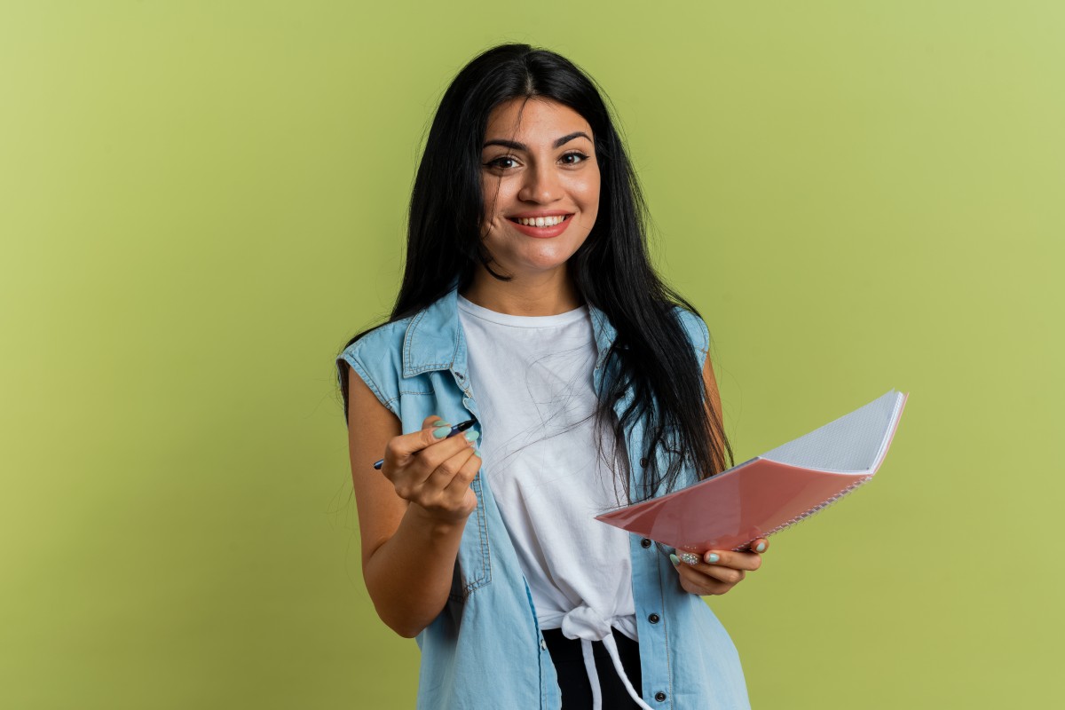 smiling-young-caucasian-girl-holds-pen-notebook-isolated-olive-green-background-with-copy-space (1).jpg smiling-young-caucasian-girl-holds-pen-notebook-isolated-olive-green-background-with-copy-space (1).jpg
