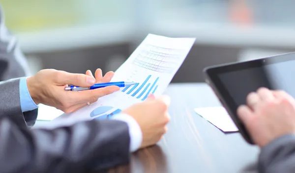 depositphotos_17382795-stock-photo-business-team-analyzing-market-research.jpg