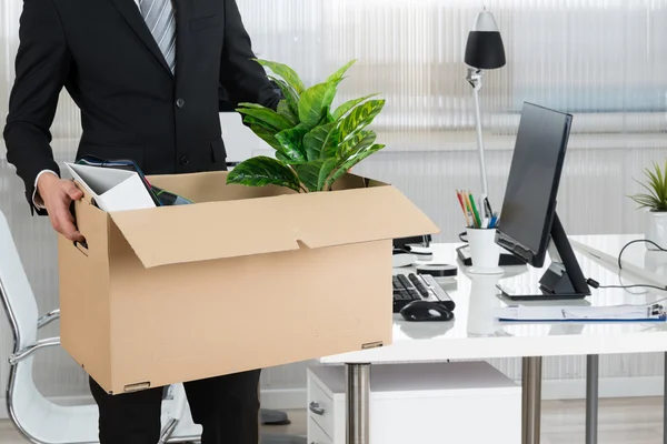depositphotos_99632160-stock-photo-businessman-carrying-cardboard-box.jpg