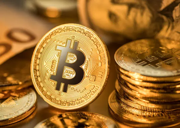 depositphotos_712730782-stock-photo-gold-bitcoin-coins-gold-background.jpg