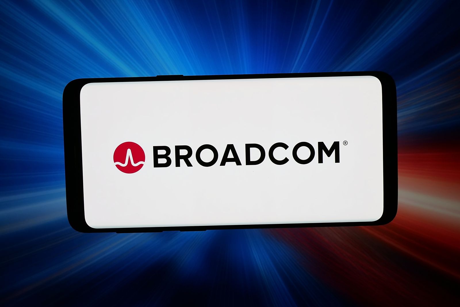 A close-up of the Broadcom logo on a smartphone by Timon via Adobe Stock